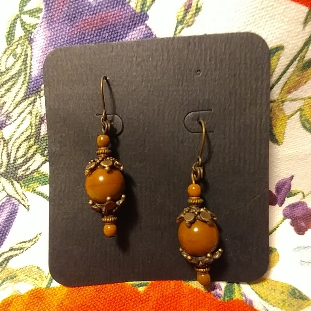 Brown beaded copper metal earrings.